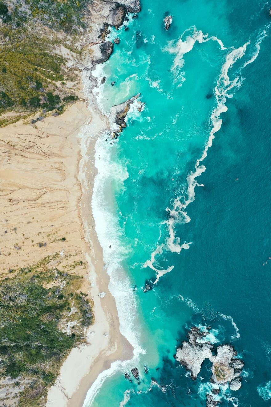 vertical-overhead-shot-beautiful-shoreline-sea-with-blue-clean-water-sandy-beach.jpg